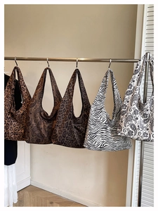 Collection of large canvas tote bags with leopard, paisley, and zebra print patterns