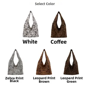 Selection of large canvas hobo bags in leopard, zebra, and paisley patterns for women