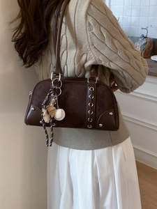 Brown vintage Boston shoulder bag with baseball charms and textured material finish