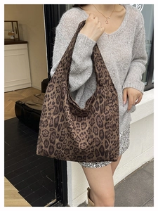 Detailed view of the large leopard print tote bag with soft fabric and wide straps