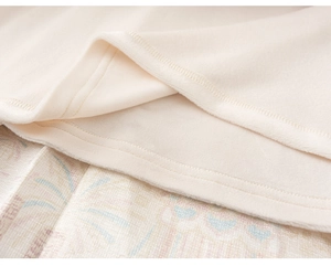 Detail shot of warm beige fleece lining and fine stitching on a girl's winter jacket