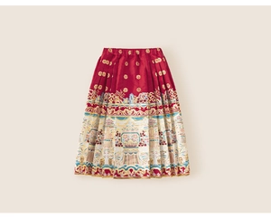 Detailed view of red Mamian skirt with golden floral brocade and traditional patterns