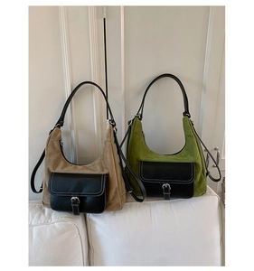 Detail of vintage matte dumpling bag showing khaki and green contrast stitching and silver buckle