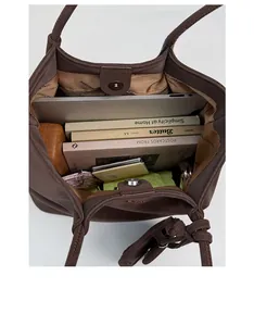 Interior view of large brown tote bag showing spacious capacity for laptop and daily items