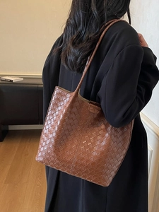 Brown woven leather tote bag with large capacity for commuting and fashion use