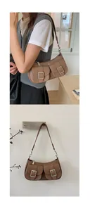 Detailed macro of vintage brown leather underarm bag with Y2K double buckle front pockets