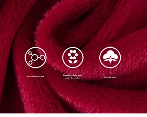 Close-up of thick deep red plush faux fur fabric showing soft texture and high density