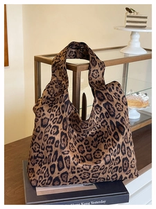 Close-up of leopard print tote bag with soft texture and wide shoulder strap