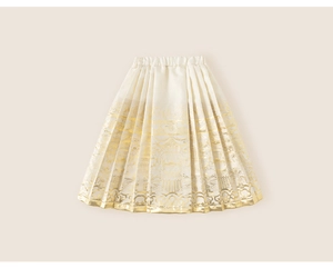 Detailed macro view of white fabric with golden cloud and dragon patterns on a pleated skirt