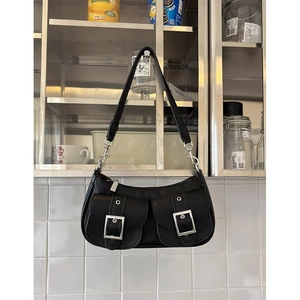 Chic black underarm bag in lychee pattern leather with bold silver buckle details
