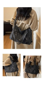 Détail du grand sac cabas gris foncé avec fermetures éclair et rivets argentés