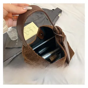 Internal capacity of brown plush tote bag showing storage of tablet and skincare items