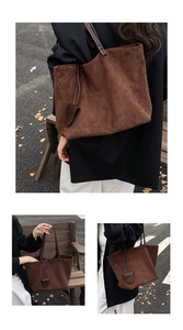 Detail view of large dark brown suede tote bag in an autumn street setting