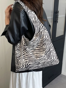 Large zebra print tote bag for women showing spacious interior and casual shoulder style