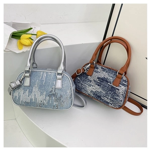 Detail of mini denim tote bags with sparkling sequins and contrasting PU handles