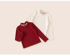 Detailed embroidery on Chinese-style stand collar blouses in red and beige tones
