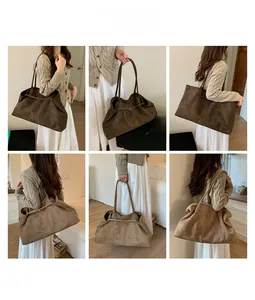 Detail view of large faux suede tote bag in dark brown and khaki with soft shoulder straps