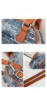 Detail of blue sequin denim bag with brown leather strap and silver metal hardware