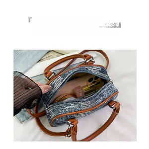 Detail view of the spacious interior of this blue sequin bag with daily essentials