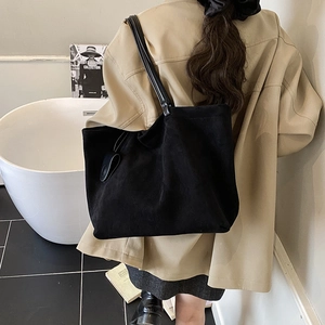 Minimalist black oversized suede tote bag with slim shoulder straps for women