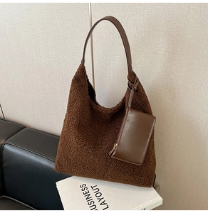 Detail of vintage brown plush tote bag with matching mini pouch and PU leather strap