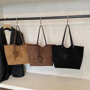 Large minimalist suede tote bag in camel, brown, and black colors for professional women