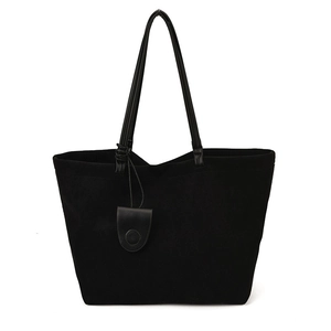 Minimalist large black suede tote bag with slim shoulder straps on white background
