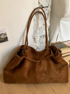 Brown faux suede oversized tote bag with long handles in a minimalist retro style