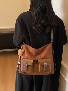 Chic retro faux suede tote bag in caramel brown with front leather buckle pockets