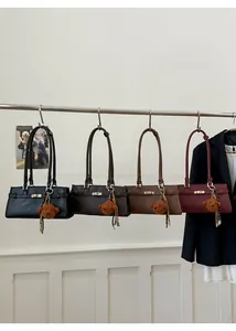 Detailed display of vintage bucket bags in black, coffee, brown, and wine red colors