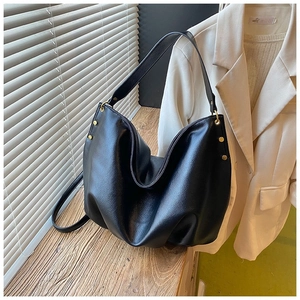 Black large capacity soft leather tote bag with gold studs and textured finish