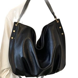Large black lychee pattern leather tote bag with gold studs and wide shoulder strap
