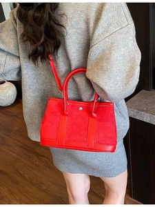 Chic red bucket bag in suede and smooth leather for women with silver metal stud detail
