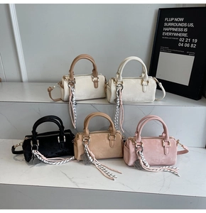 Collection of five Boston bags in velvet finish with woven charms and shoulder straps