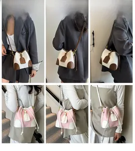 Detail shots of contrast bucket bags with lychee grain leather and drawstring closure