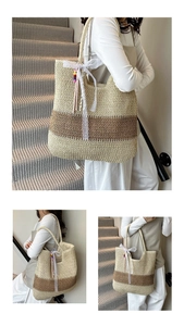 Detail of striped straw tote bag featuring white lace ribbon and colorful beaded charm