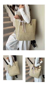 Close-up of beige straw woven tote bag featuring white lace bow and colorful fringe details