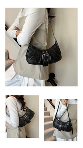 Three-way view of a black crescent underarm bag in retro distressed leather finish