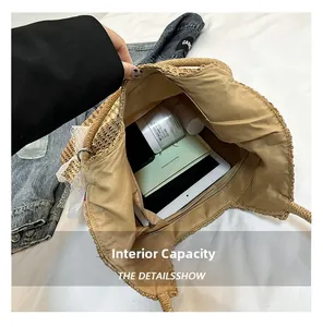Top view of large straw tote interior with tablet and cosmetics showing high capacity