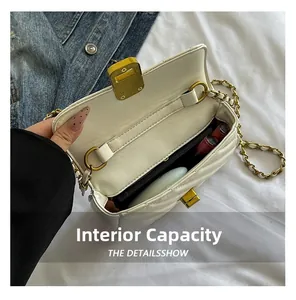Detail of the white quilted chain bag showing internal capacity for phone and lipstick