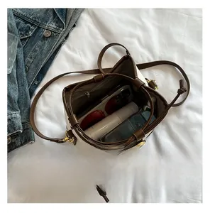 Internal view of a color-block bucket bag showing spacious storage for daily items