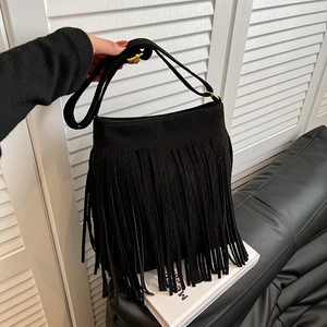 Fashionable black suede crossbody bag with fringe tassels and gold-tone metal hardware