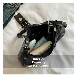 Interior view of black crescent bag showing spacious compartment and zipper pocket