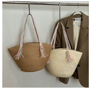 Large summer woven straw tote bag with colorful rainbow handles and bohemian tassels