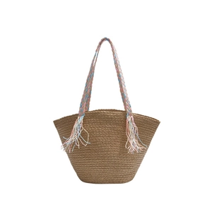 Large woven tote straw bag with colorful braided handles and decorative long tassels