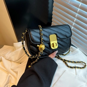 Fashionable black V-quilted crossbody bag with gold chain strap and pineapple metal pendant
