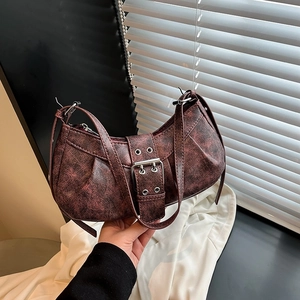 Retro crescent underarm bag in dark brown distressed leather with metal buckle accent