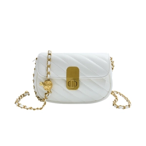 White quilted crossbody bag with gold chain strap and pineapple charm, 2025 fashion style