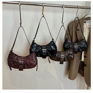 Detailed display of vintage crescent hobo bags in wine red, black, and dark coffee