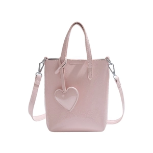 Pink PU leather crossbody phone bag with heart charm and detachable strap for women